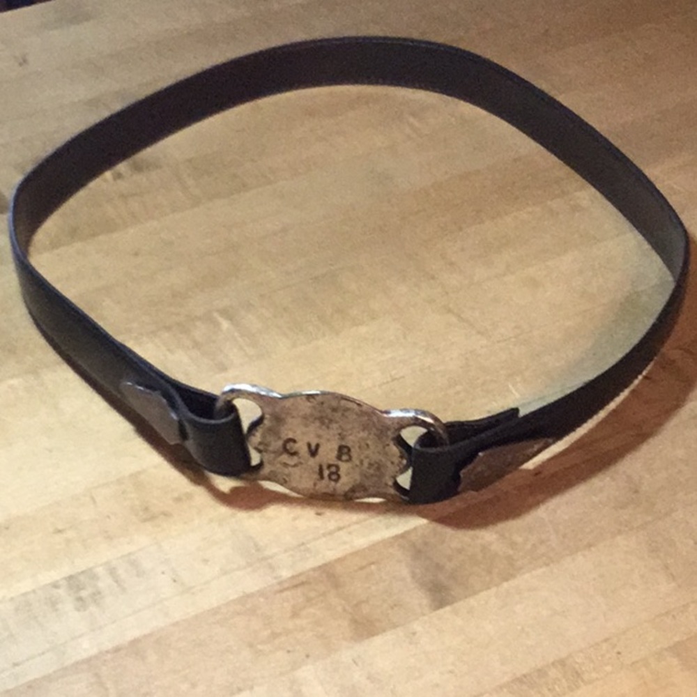 Black belt w/distressed silver metal buckle. 38”